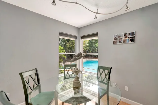 a dining room with furniture and window
