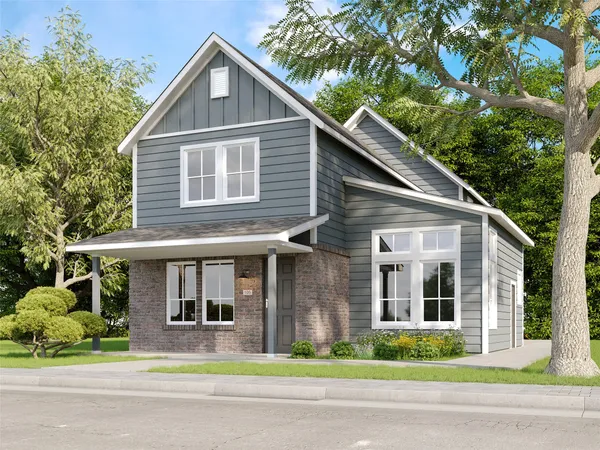a front view of a house with a garden and plants
