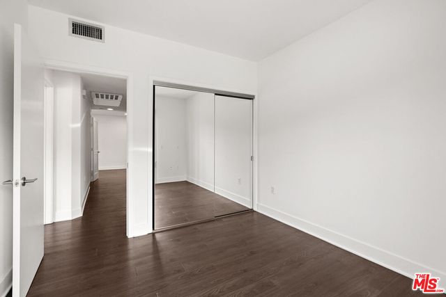 a view of a storage & utility room with closet