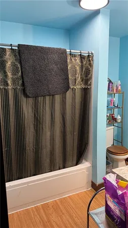 a view of storage and utility room with clothes