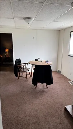 a room with table closet and couch