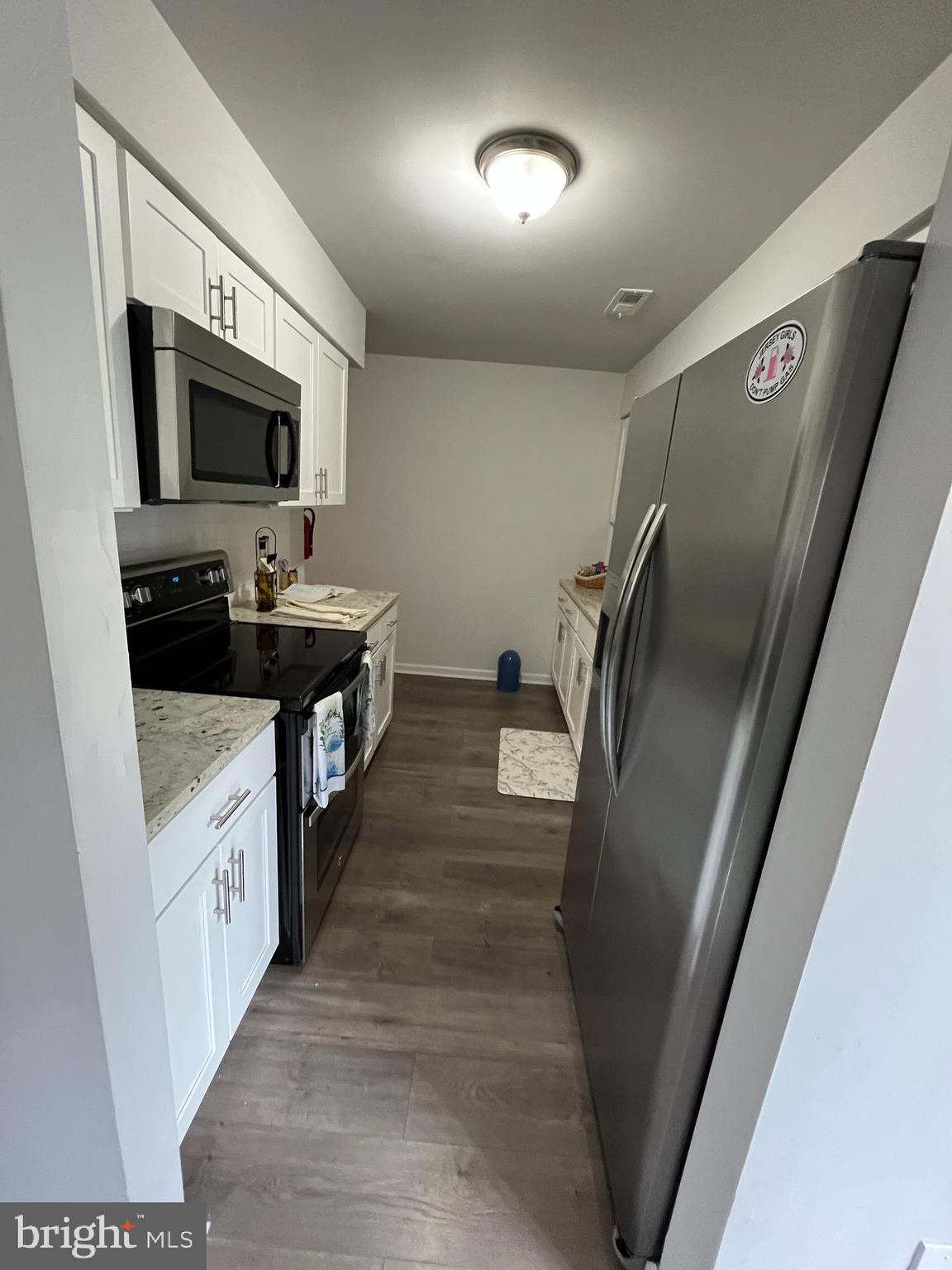 707B Cypress Point Circle Mount Laurel, NJ 08054 - Photo 11 of 18 a kitchen with stainless steel appliances a sink stove and refrigerator