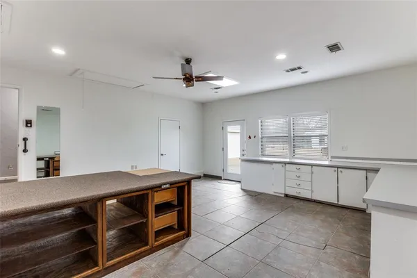 a kitchen with a stove and a sink