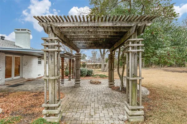 a view of a porch with a wooden fence