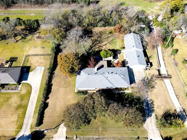 an aerial view of a house with a ocean view