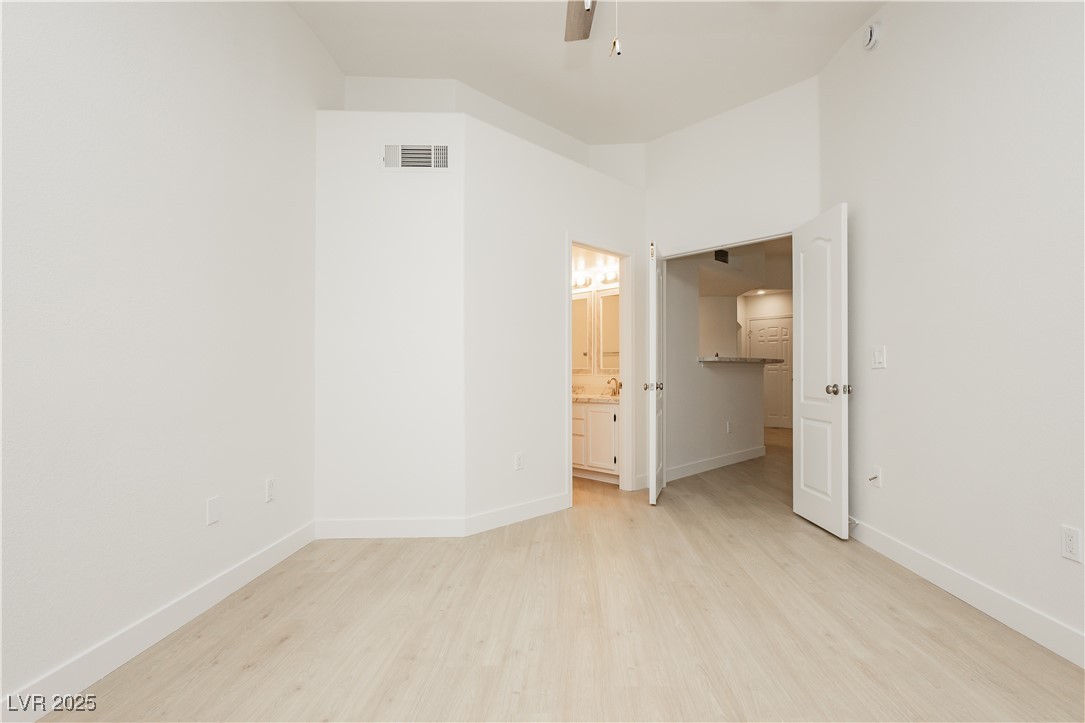 7400 West Flamingo Road, Unit 2033 Las Vegas, NV 89147 - Photo 19 of 38 Primary Bedroom with double doors.