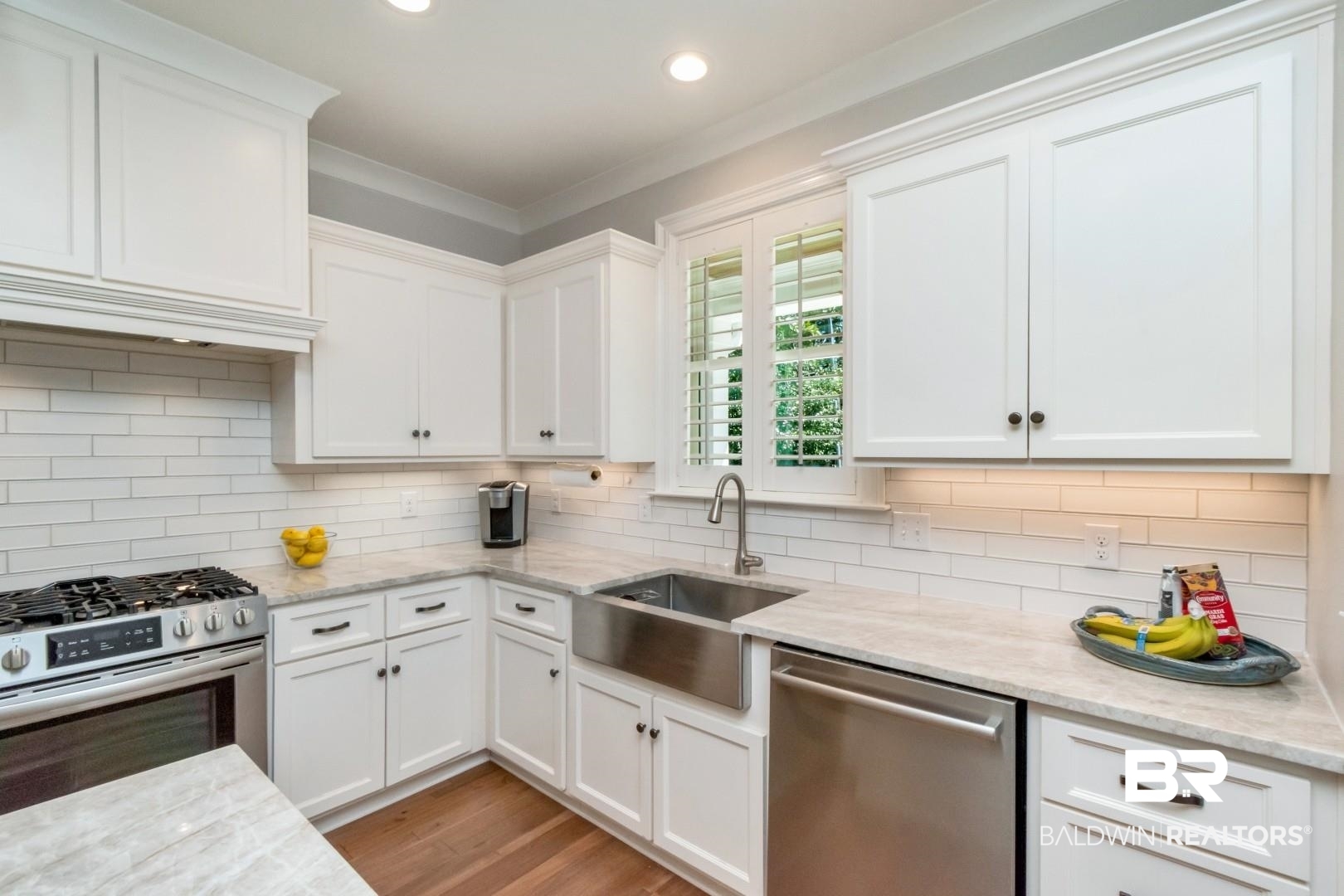 4404 Stein Street Mobile, AL 36608 - Photo 18 of 50 Kitchen with appliances with stainless steel finishes, white cabinetry, recessed lighting, and crown molding