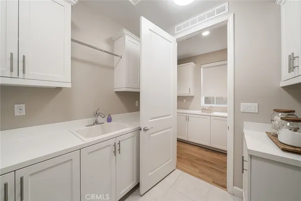 a large kitchen with stainless steel appliances kitchen island granite countertop a large island in the center