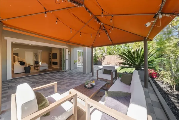 a white toilet sitting next to a white wall