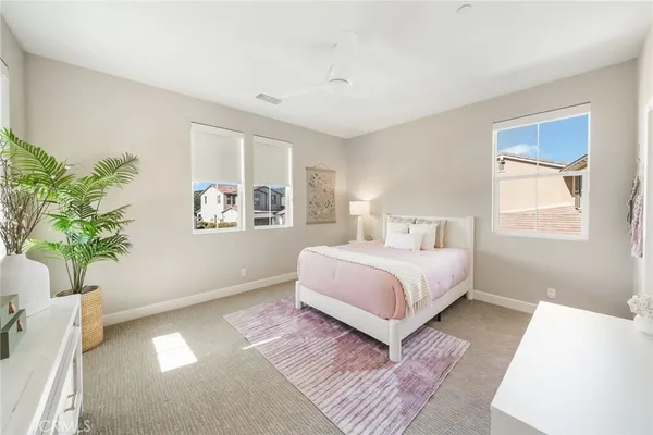 a living room with lots of furniture and white walls