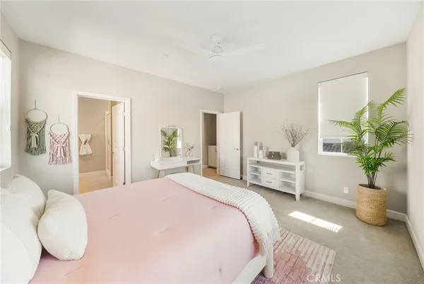 an aerial view of residential houses with outdoor space and pool