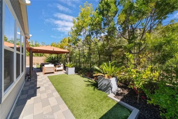 an outdoor space with swimming pool and furniture