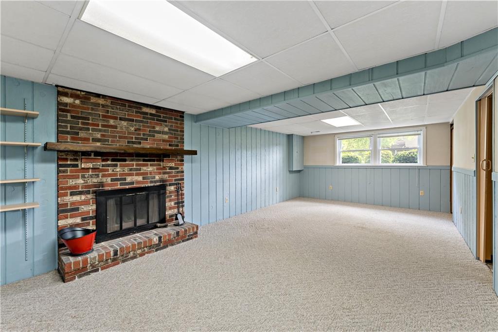 27 Dover Road Irwin, PA 15642 - Photo 23 of 43 a living room with furniture and a fireplace