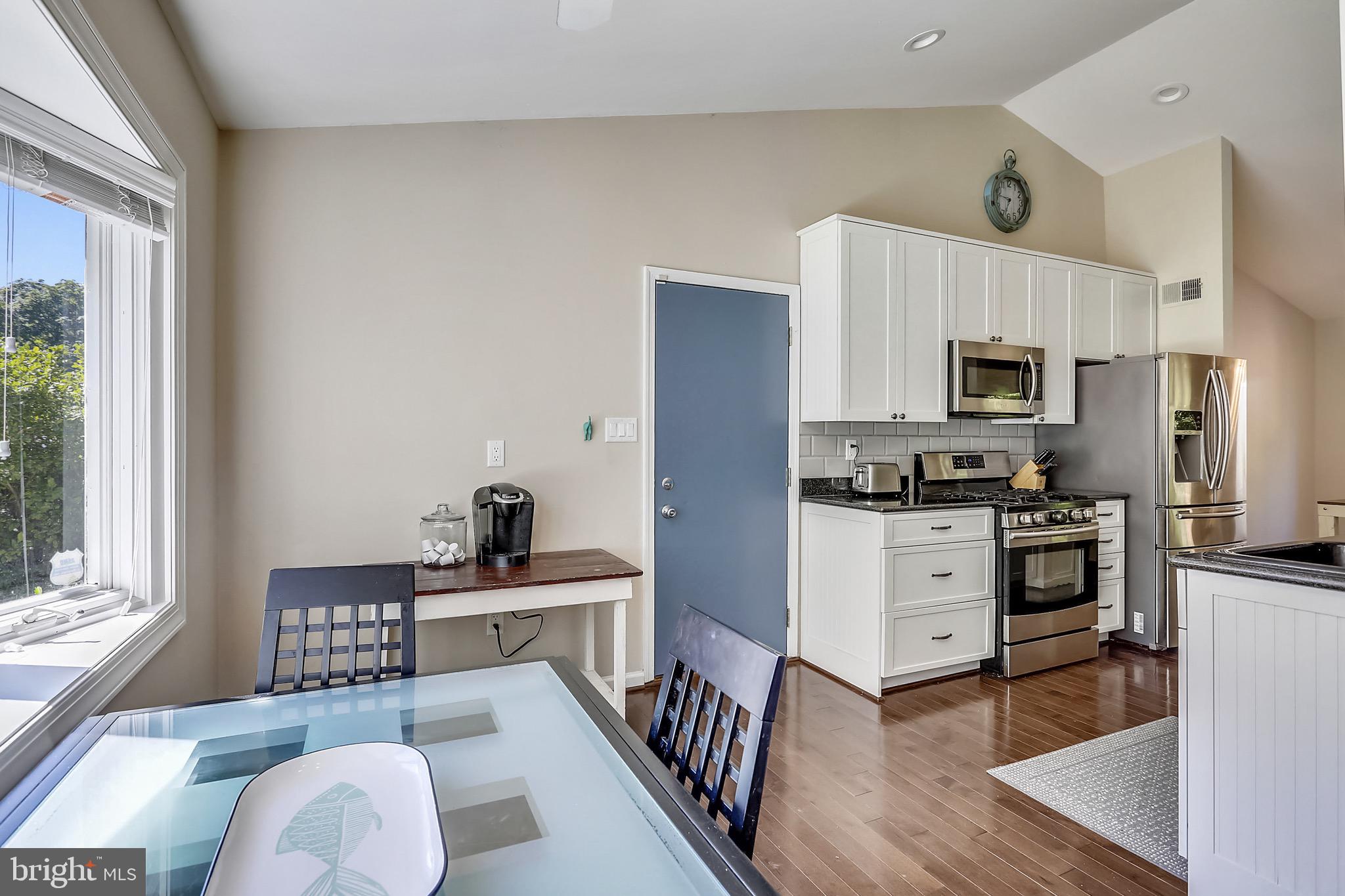 14216 Piccadilly Road Silver Spring, MD 20906 - Photo 8 of 42 Kitchen with eat-in area and garage entrance