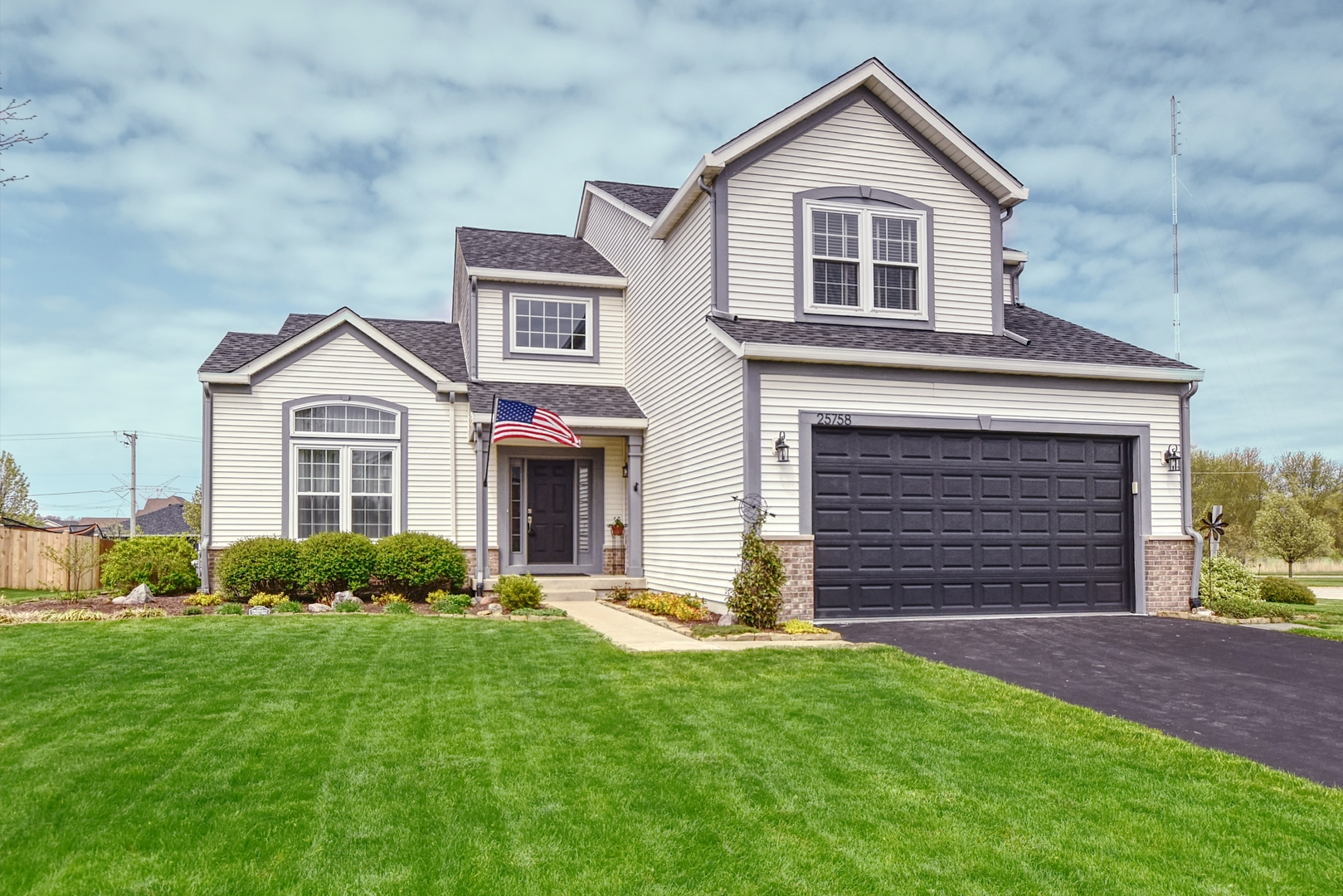 25758 South Basswood Road Channahon, IL 60410 - Photo 1 of 28 a front view of a house with a yard and garage