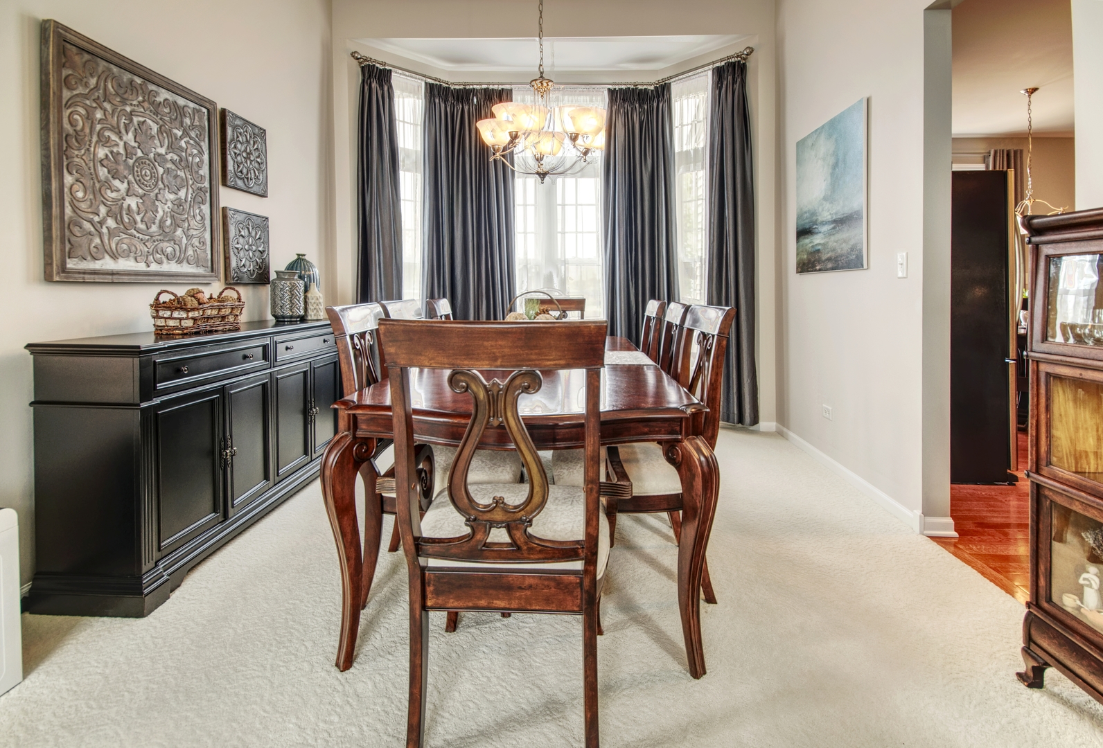 25758 South Basswood Road Channahon, IL 60410 - Photo 8 of 28 a view of a dining room with furniture and a chandelier