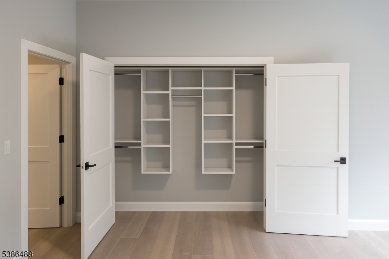 391 Springfield Avenue, Unit 3H Berkeley Heights, NJ 07922 - Photo 12 of 14 a view of an empty walk in closet