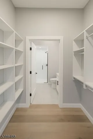 a view of a bathroom with a sink and a mirror