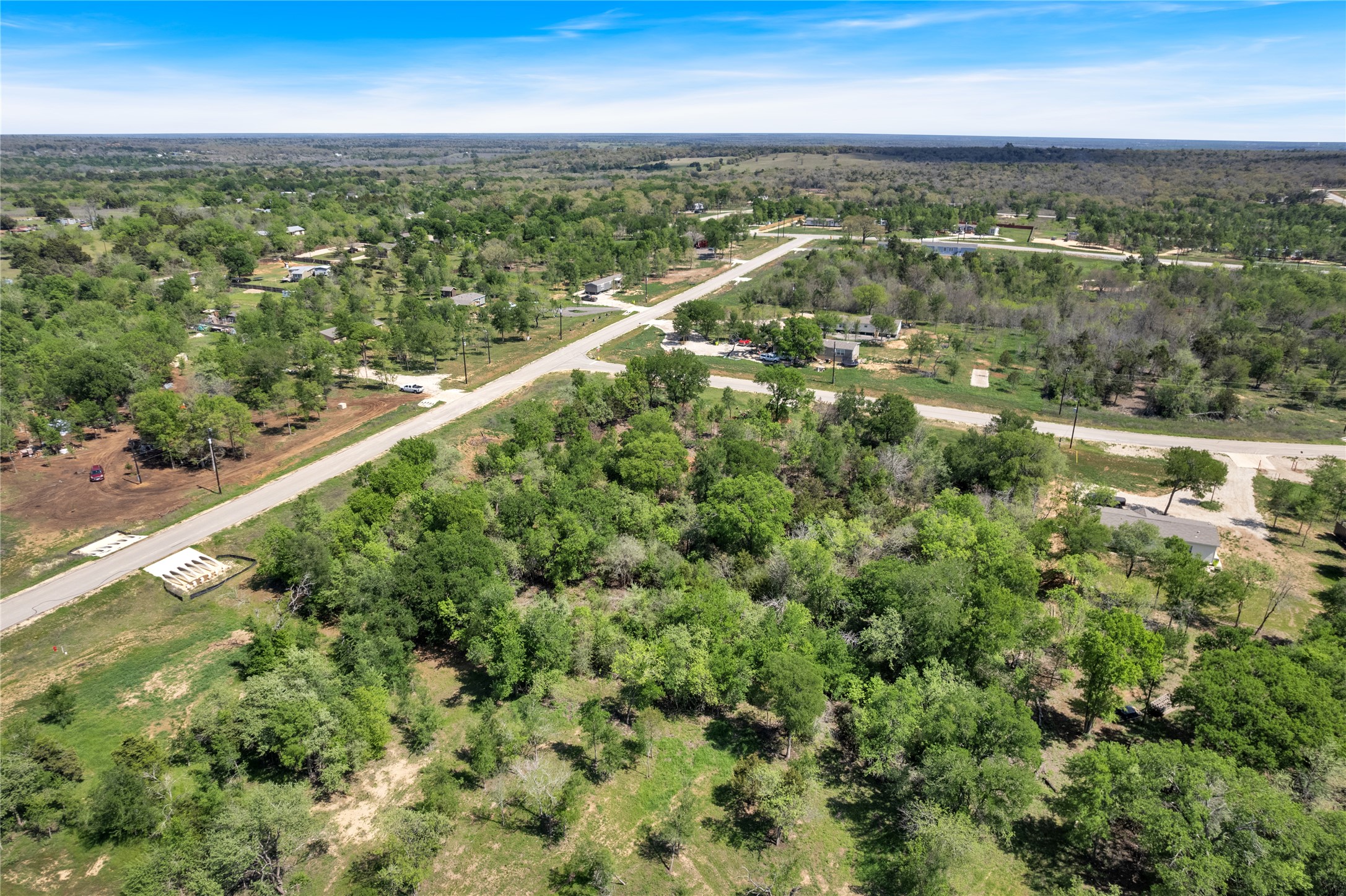 114 Empire Street Elgin, TX 78621 - Photo 9 of 36 Aerial view featuring a forest view