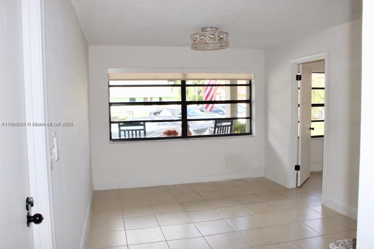 5181 Kim Court West Palm Beach, FL 33415 - Photo 11 of 24 a view of an empty room with a window