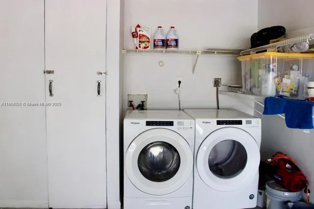 a utility room with dryer and washer