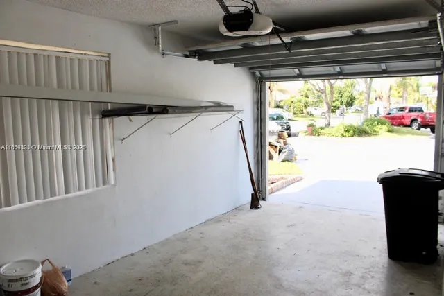 a view of a house with backyard and porch