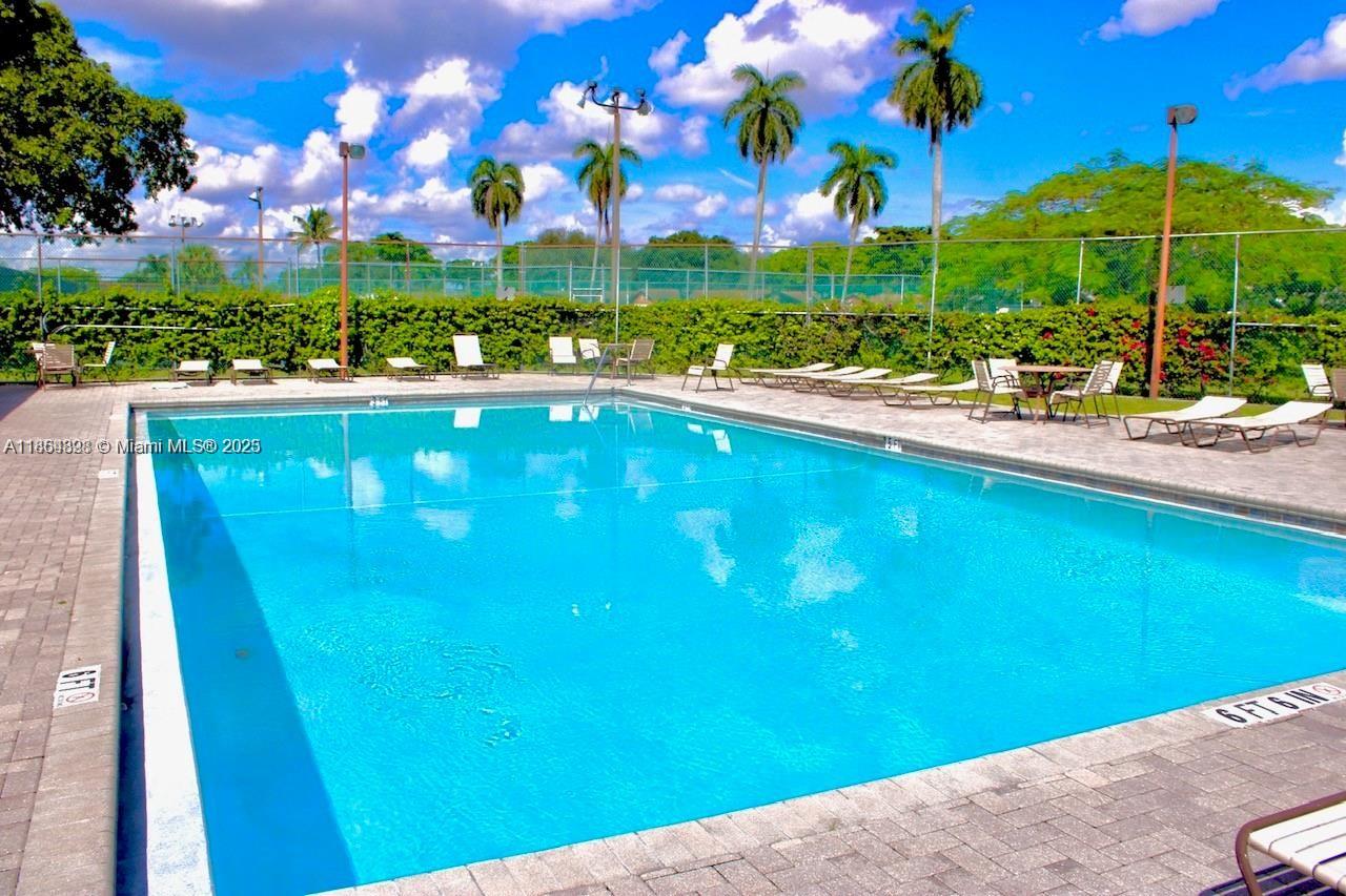 5181 Kim Court West Palm Beach, FL 33415 - Photo 22 of 24 a view of a swimming pool and outdoor seating