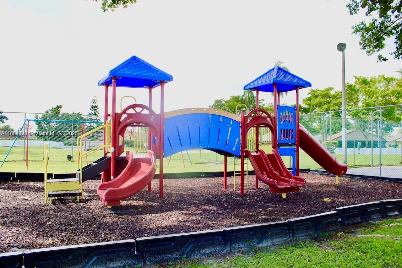 5181 Kim Court West Palm Beach, FL 33415 - Photo 23 of 24 a view of a wooden deck with a slide