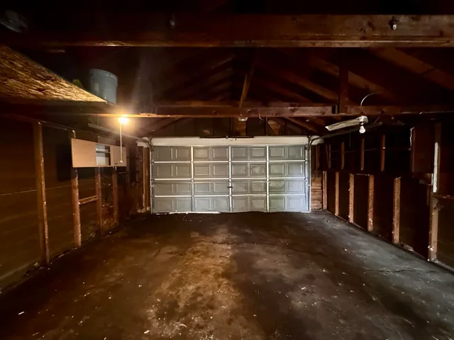 a view of an empty room with wooden walls