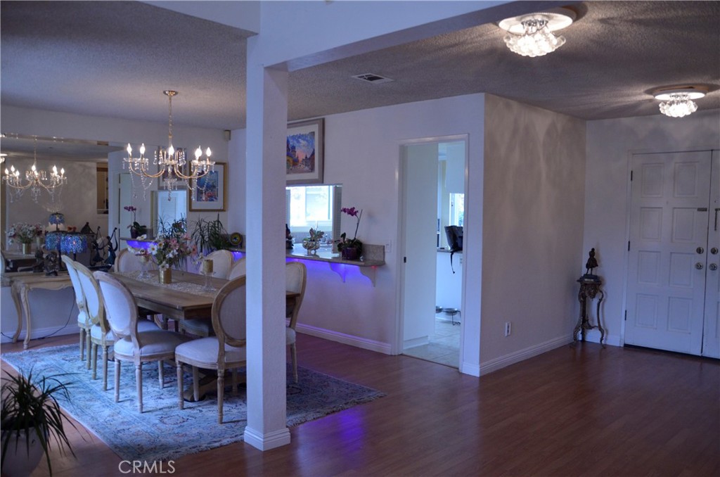 6574 Carioca Lane Riverside, CA 92506 - Photo 21 of 45 a view of a dining room with furniture and wooden floor