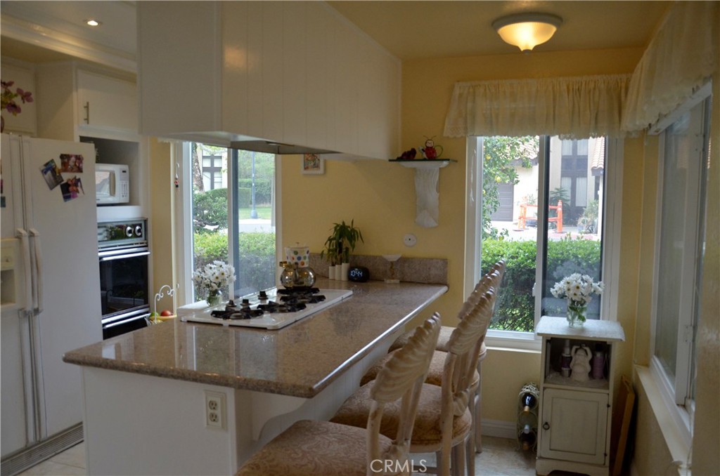 6574 Carioca Lane Riverside, CA 92506 - Photo 26 of 45 a room with furniture and large windows