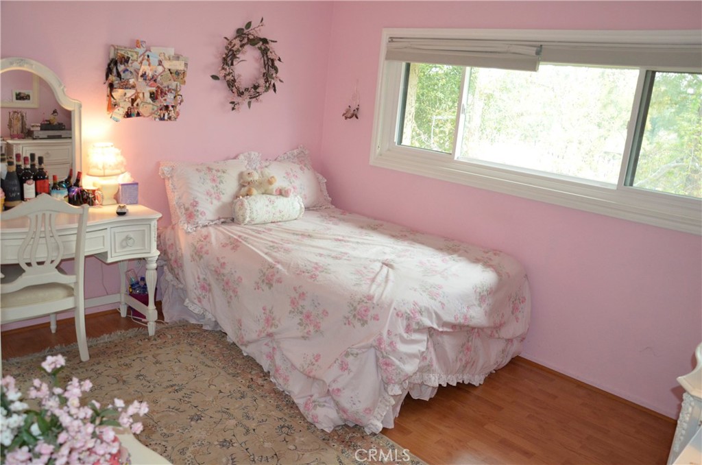 6574 Carioca Lane Riverside, CA 92506 - Photo 4 of 45 a bed sitting in a bedroom next to a window