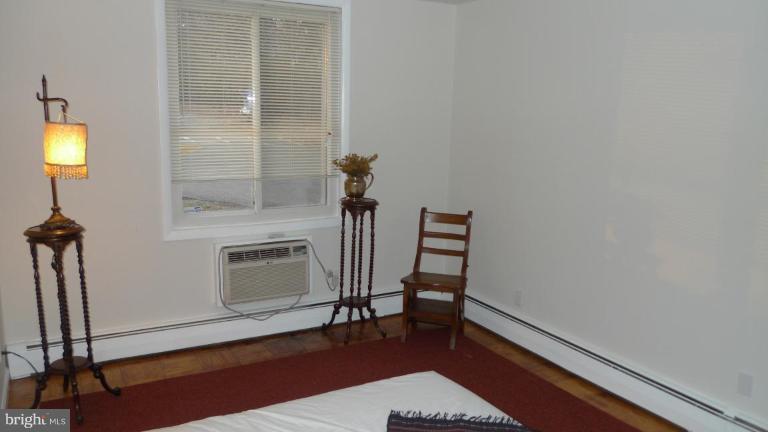 3000 7th Street Northeast, Unit 124 Washington, DC 20017 - Photo 13 of 27 a living room with furniture and a fireplace