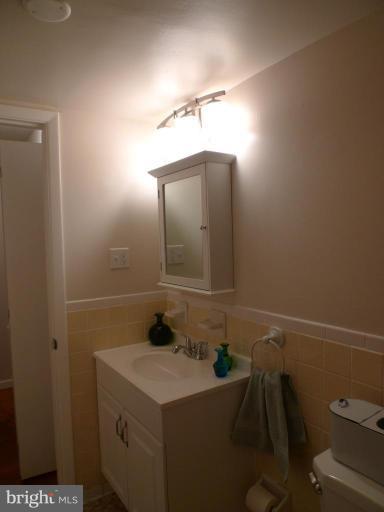 3000 7th Street Northeast, Unit 124 Washington, DC 20017 - Photo 17 of 27 a bathroom with a sink and a mirror