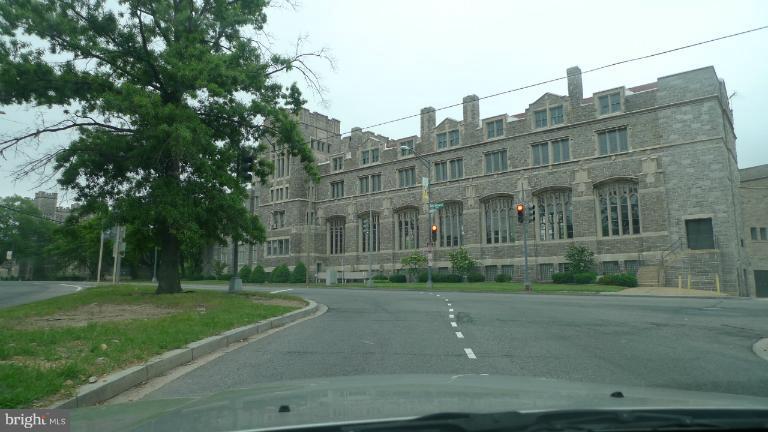 3000 7th Street Northeast, Unit 124 Washington, DC 20017 - Photo 26 of 27 a view of a building with a yard