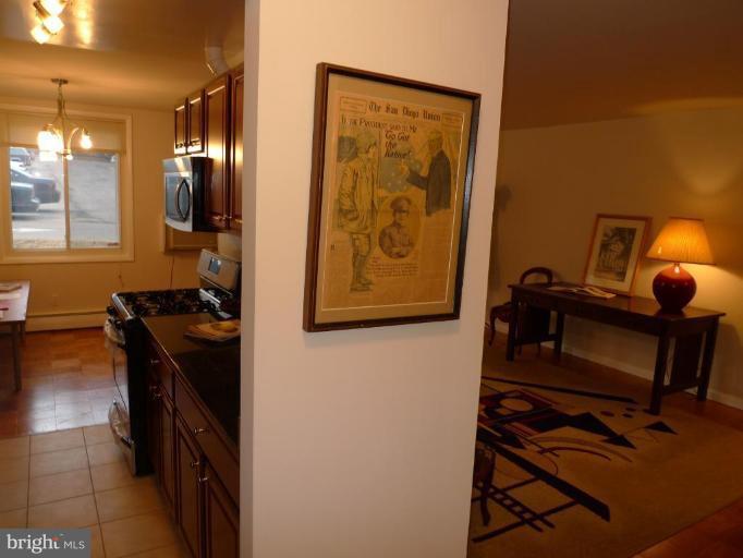 3000 7th Street Northeast, Unit 124 Washington, DC 20017 - Photo 6 of 27 a view of a hallway with workspace and a window