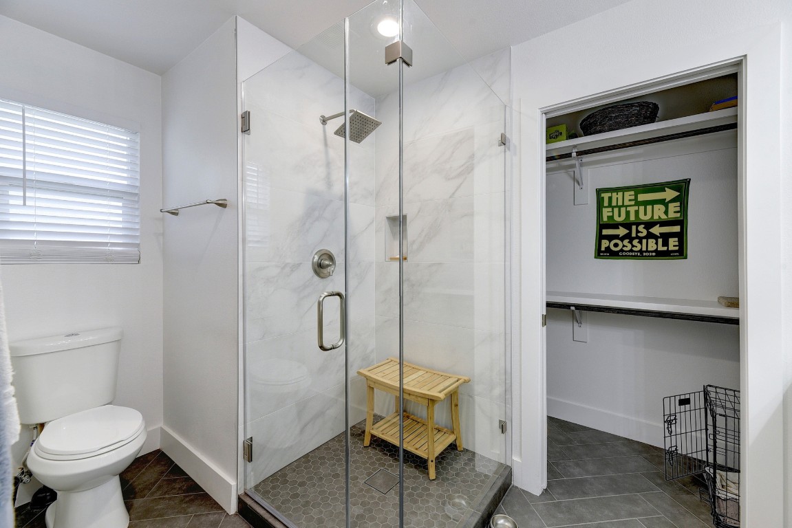 300 Lightsey Road, Unit 1 Austin, TX 78704 - Photo 11 of 21 a bathroom with a toilet and a shower