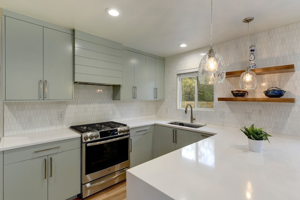300 Lightsey Road, Unit 1 Austin, TX 78704 - Photo 5 of 21 a kitchen that has a sink and a stove
