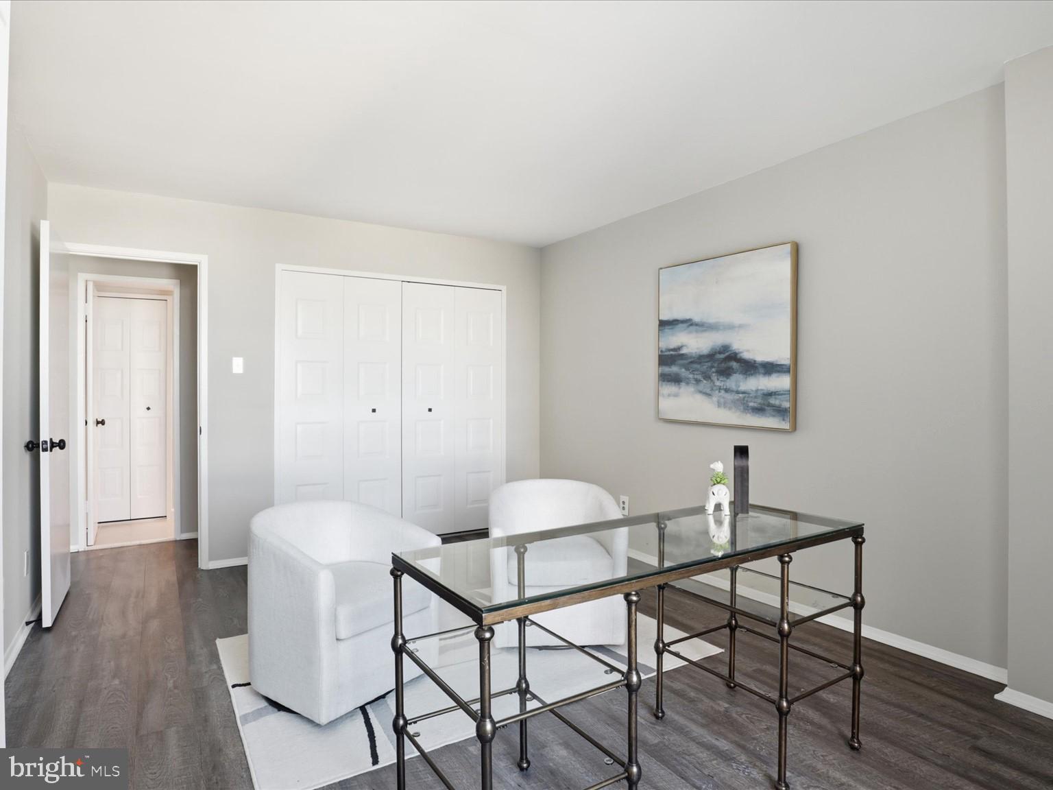 1800 Old Meadow Road, Unit 1017 McLean, VA 22102 - Photo 18 of 31 a view of a room with furniture and wooden floor