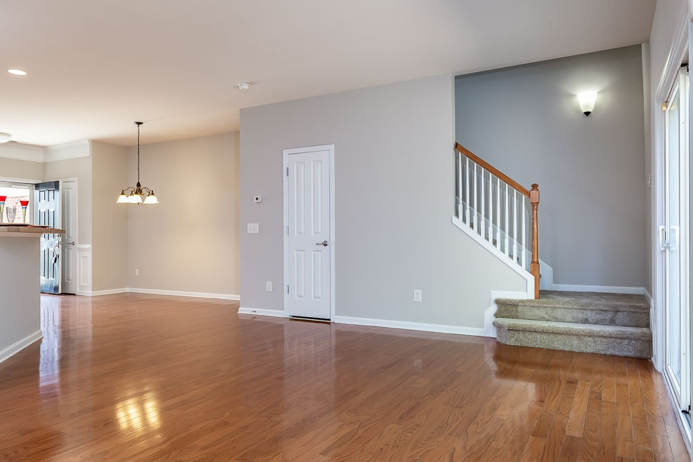 8722 Owl Roost Place Raleigh, NC 27617 - Photo 10 of 26 Open and friendly with the stairs tucked away for access to the bedrooms. Downstairs Living Space