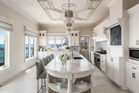 a large kitchen with cabinets and stainless steel appliances
