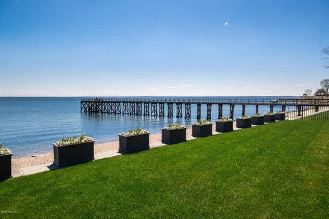 a view of a chair and fire pit in the backyard