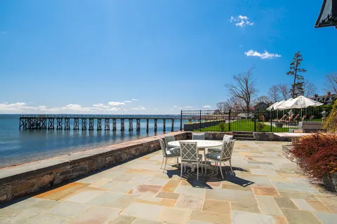 a patio with table and chairs