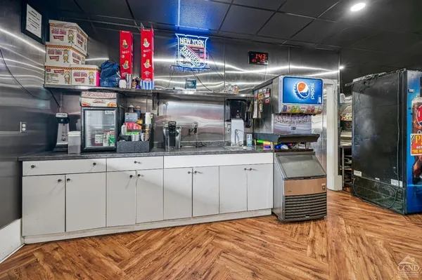 a kitchen with stainless steel appliances granite countertop a sink and cabinets