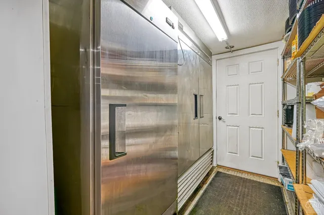 a kitchen with a stove a sink and a refrigerator