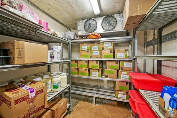 a room with gym equipment and windows