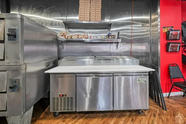 a bedroom with furniture and a flat screen tv