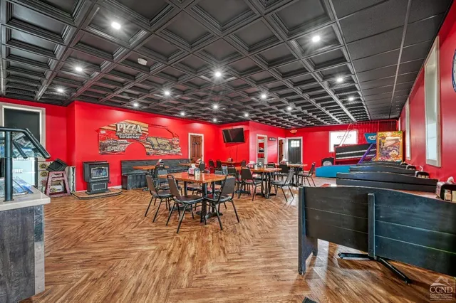 a view of a hallway with paintings on the wall