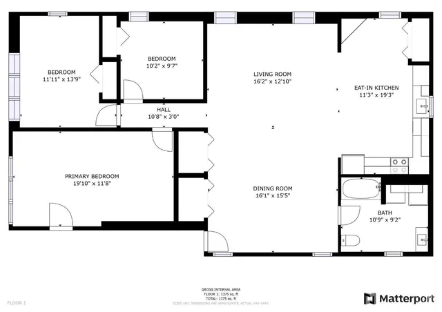 an aerial view of a swimming pool with a yard