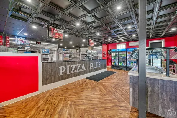 a kitchen with stainless steel appliances granite countertop a sink and wooden cabinets